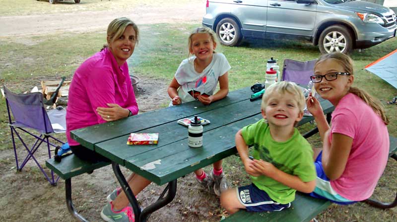 playing uno at the campsite